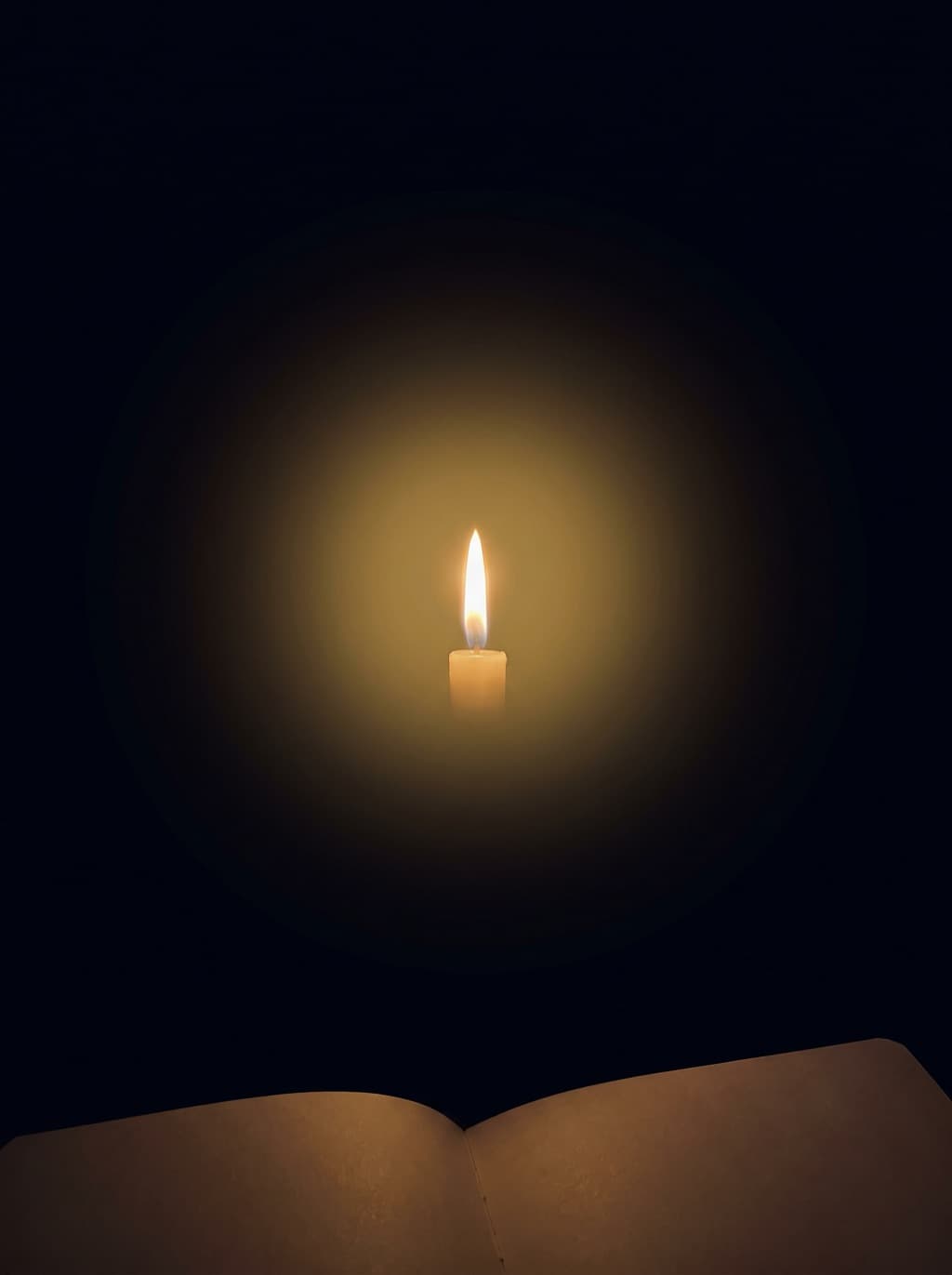 A single candle flame in the dark, above an open journal